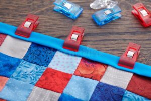 sewing clips holding a quilt